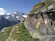 La segnaletica gialla ci ricorda che siamo su un tratto dell'Alta Via della Val Malenco. Sullo sfondo il Monte Disgrazia