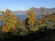 Panorama sulla costa occidentale dell'isola la Presolana innevata, la Corna Trentapassi e il paese di Sinchignano.