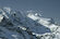 Austera visione del versante Nord del Piz Pal. Sullo sfondo l'acuminata cima della Cresta Guzza.